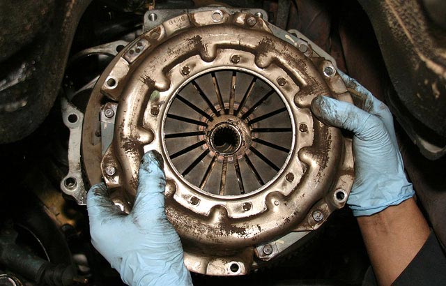 Thumbnail of a mechanic working on clutch repair